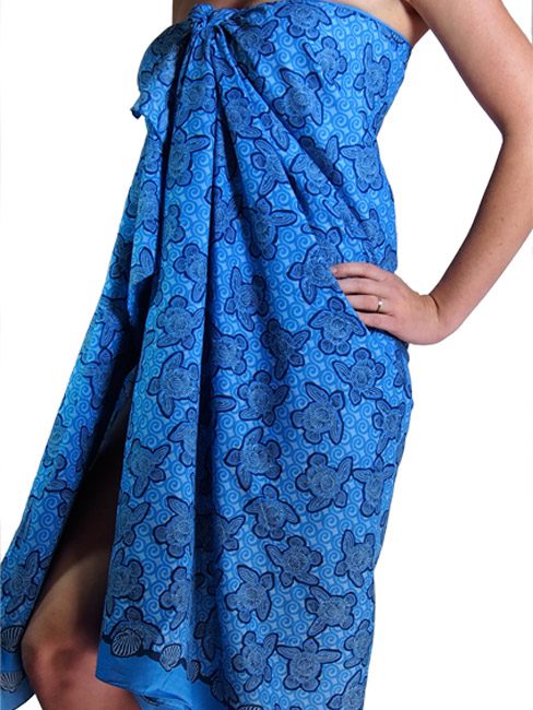 cotton sarong or pareo with turtles made out of shells swimming in the sea. summer beach cover up