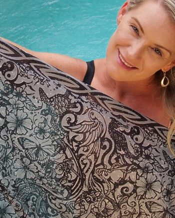 tattoo grey is a black design on a grey back ground showinga mermaid luring a pirate and his ship onto the rocks 100% cotton sarong plus 2.1 meters long on light weight Indian cotton voile 2.1 meters long.