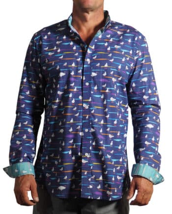 men's fitted 100% cotton long sleeved shirt printed with a design of seagulls and bin chickens on a navy blue background with contrasting cuff and placket
