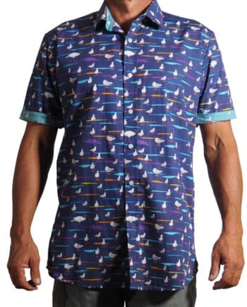 men's fitted 100% cotton short sleeved shirt printed with a design of seagulls and bin chickens on a navy blue background with contrasting cuff and placket