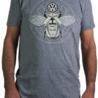 180-gram grey marle cotton t-shirt printed with a motif of a beetle car morphing into a scarab beetle clutching a VW logo in black and white ink.