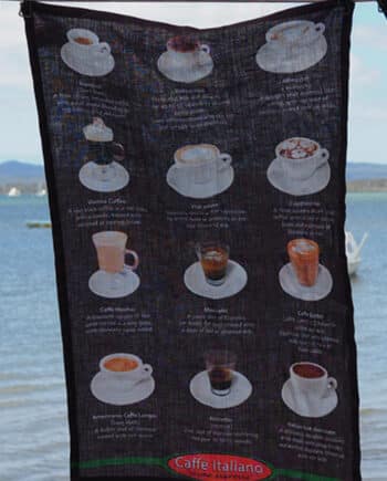 tea towel 80% linen 20% cotton very absorbent printed with a pattern of different coffe cups showing how to make the various coffees shown on a coffee brown coloured back ground
