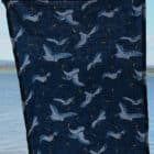tea towel 80% linen 20% cotton very absorbent printed with a pattern of seagulls fighting over potato chips in the air on a dark blue back ground