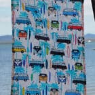 tea towel 80% linen 20% cotton very absorbent printed with a pattern of Kombi vans, surf boards and palm trees on a white back ground