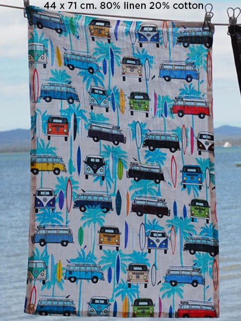 tea towel 80% linen 20% cotton very absorbent printed with a pattern of Kombi vans, surf boards and palm trees on a white back ground