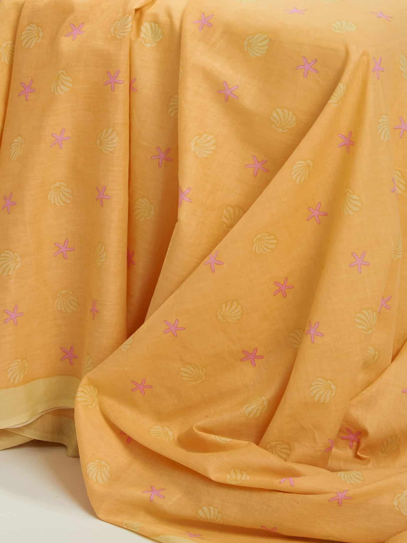 pink starfish and shells on a delicate orange back ground100% cotton sarong plus 2.1 meters long on light weight Indian cotton voile t2.1 meters long.
