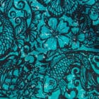 a close up of the original hand drawn tattoo jade sarong design in black ink on a jade green background
