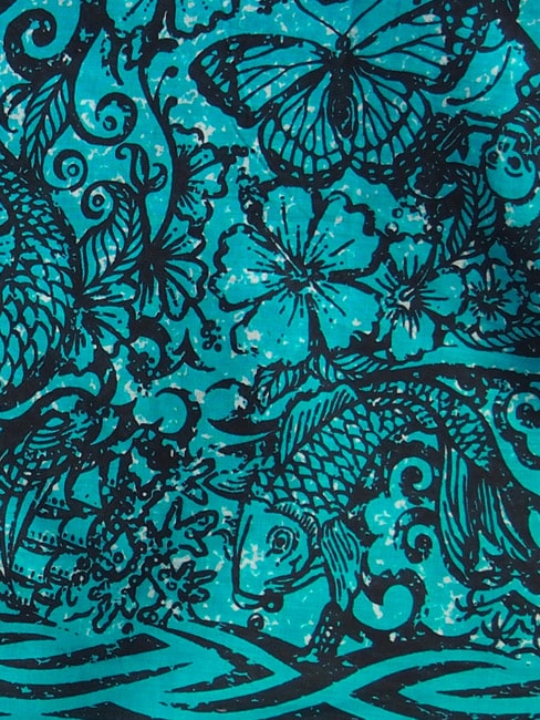 a close up of the original hand drawn tattoo jade sarong design in black ink on a jade green background