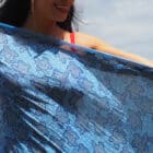 Blue turtles made out of shells arranged to look like turtles on a blue background printed on 100% indian cotton voile sarong light weight 2.1 meters long prefect for summer on the beach.