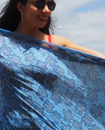 Blue turtles made out of shells arranged to look like turtles on a blue background printed on 100% indian cotton voile sarong light weight 2.1 meters long prefect for summer on the beach.